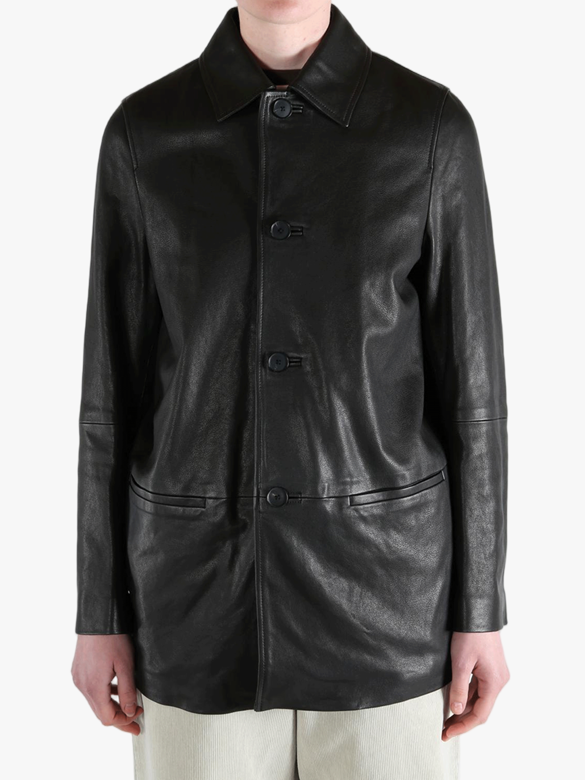 Black jacket worn by a person, showing the jacket's fit