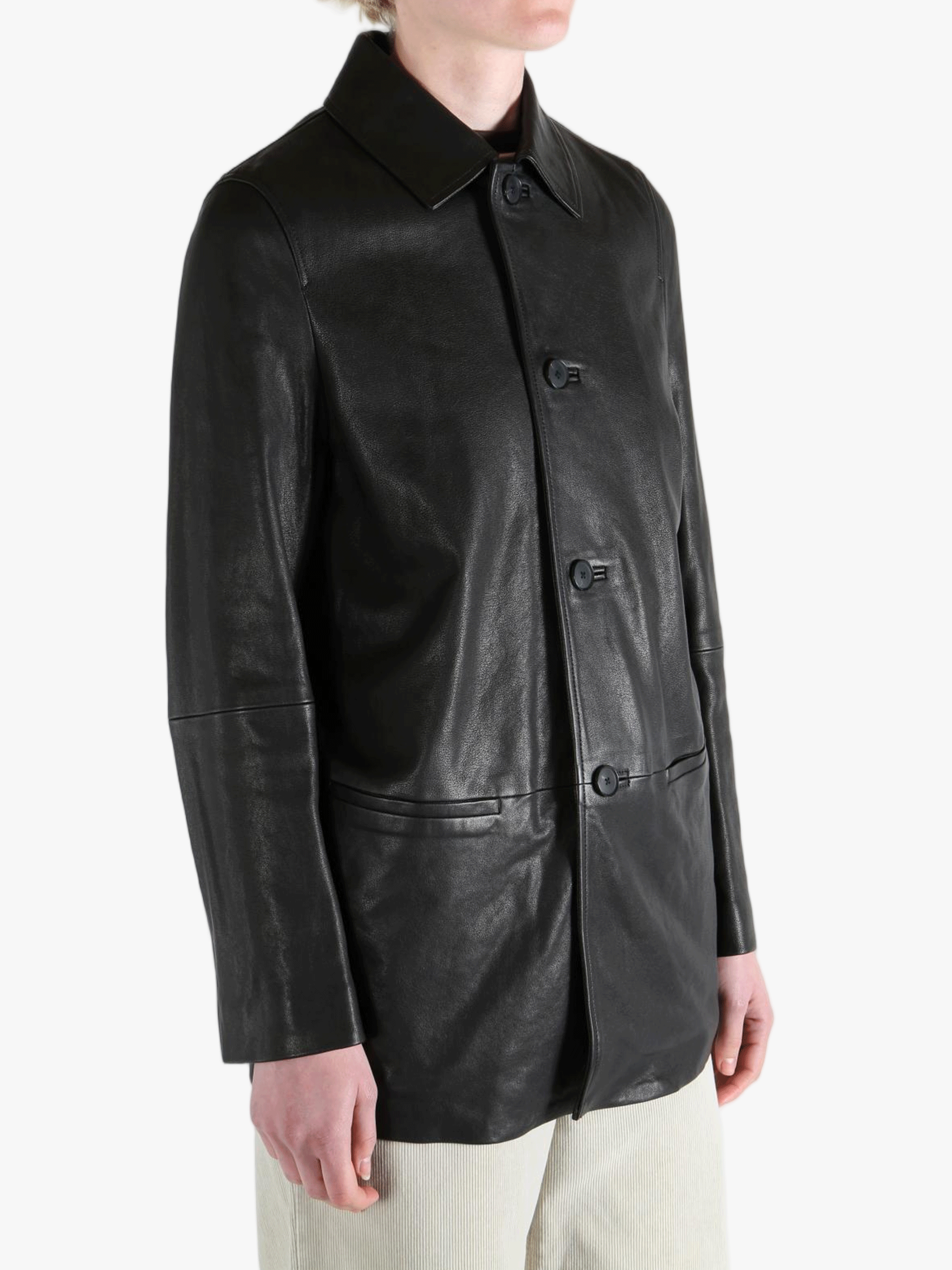 Black jacket worn by a person, showing the jacket's fit