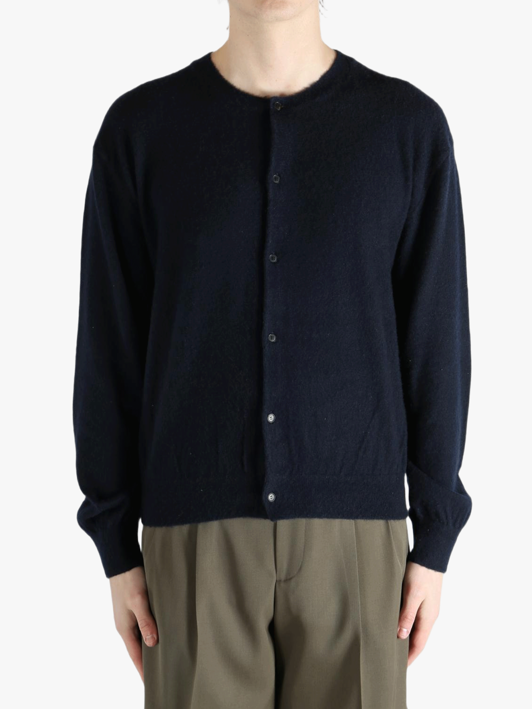Navy knitwear worn by a person, showing the knitwear's fit