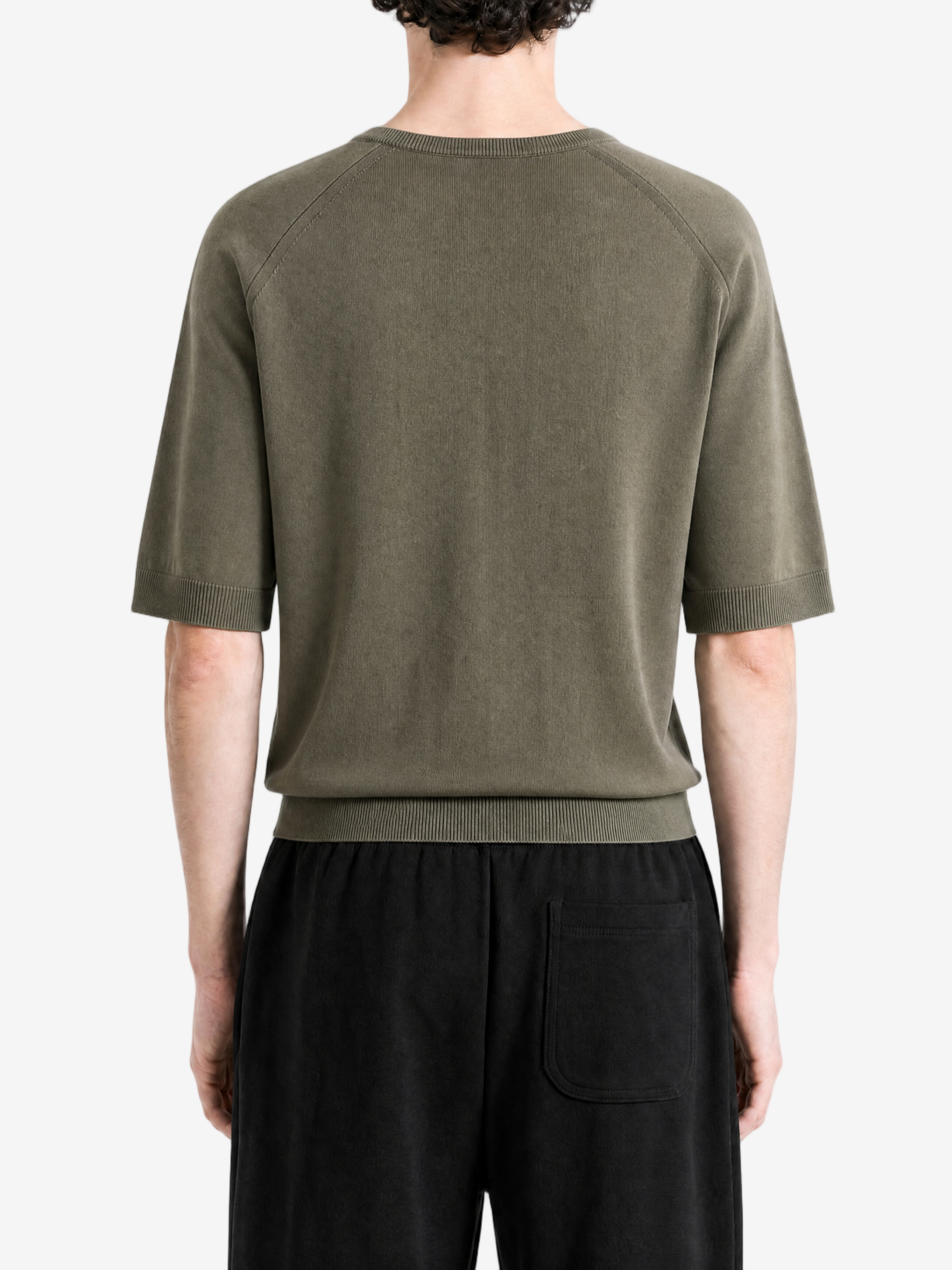Green knitwear worn by a person, back view