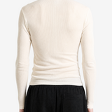 Tan top worn by a person, back view