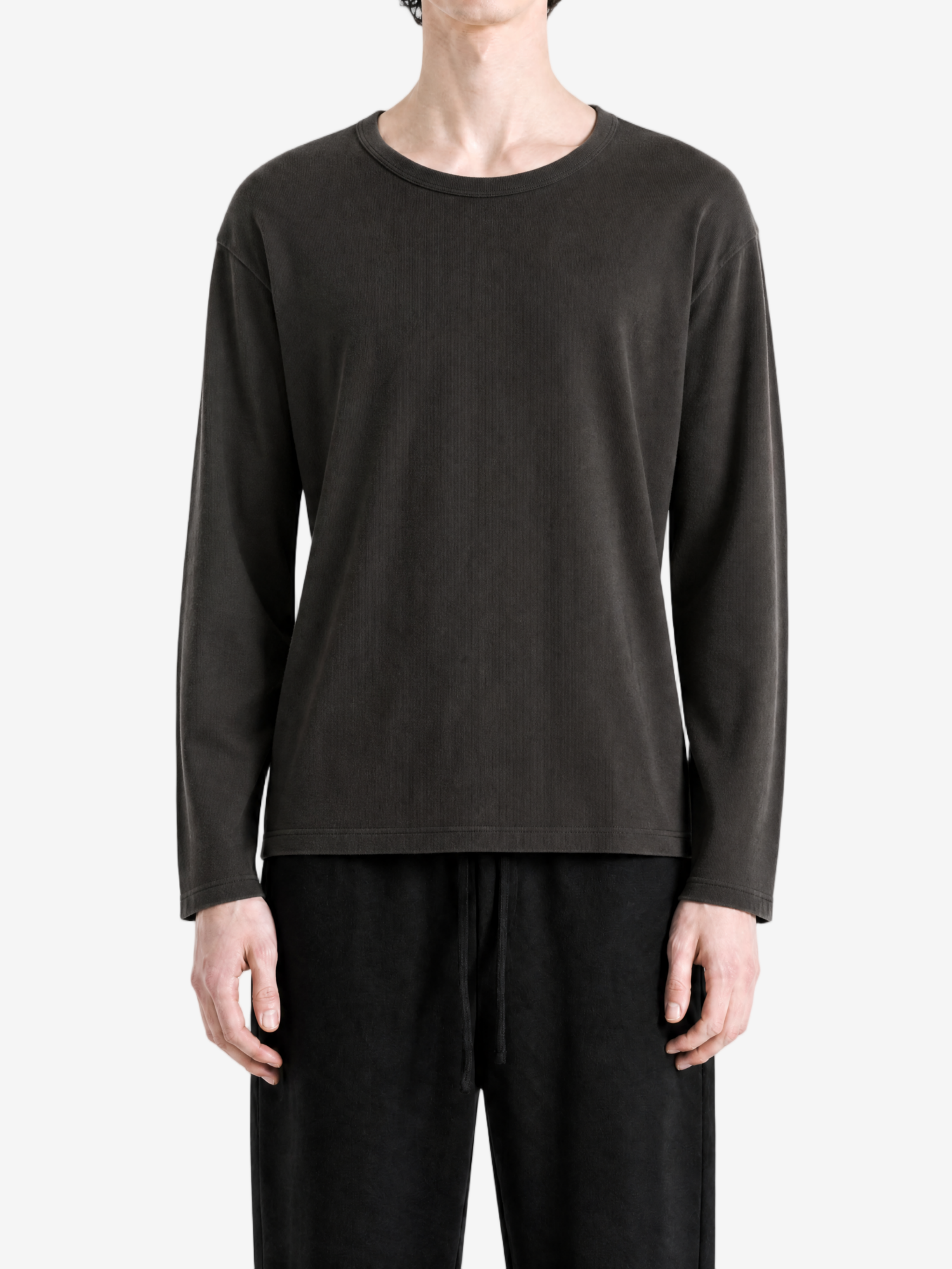 Black t-shirt worn by a person, showing the t-shirt fit
