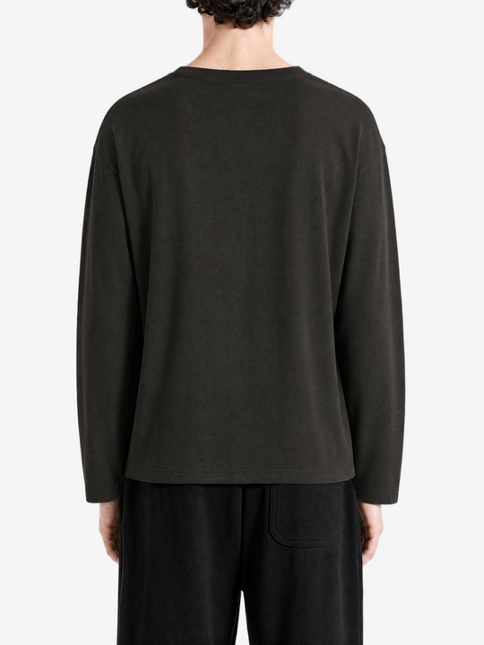 Black t-shirt worn by a person, back view