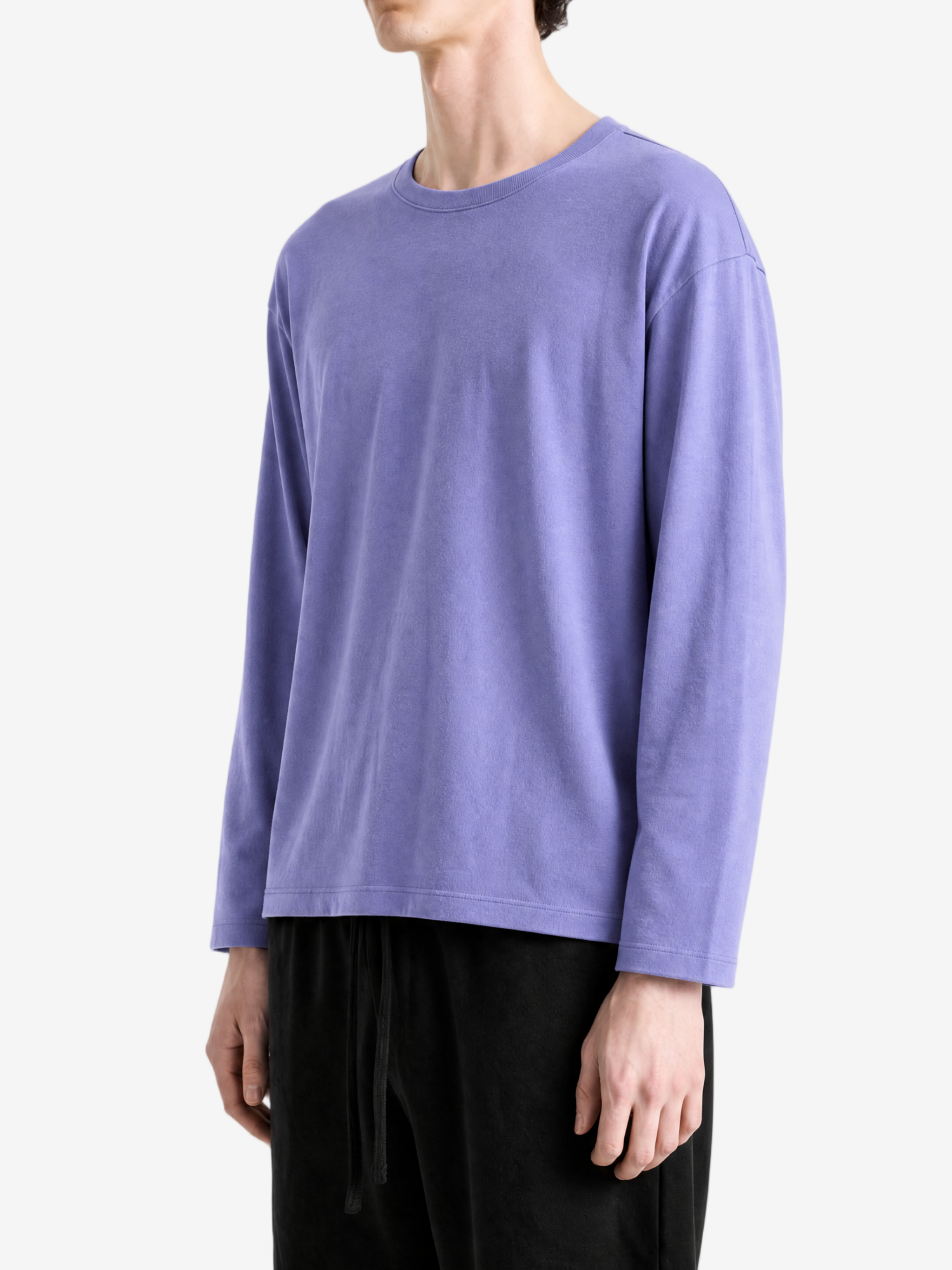 Purple t-shirt worn by a person, side view
