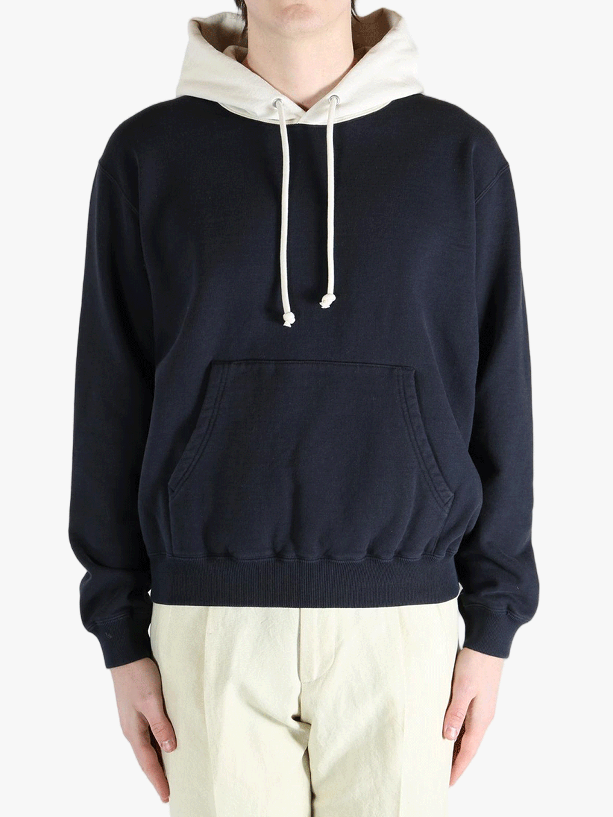 Navy hoodies worn by a person, showing teh hoodies' fit