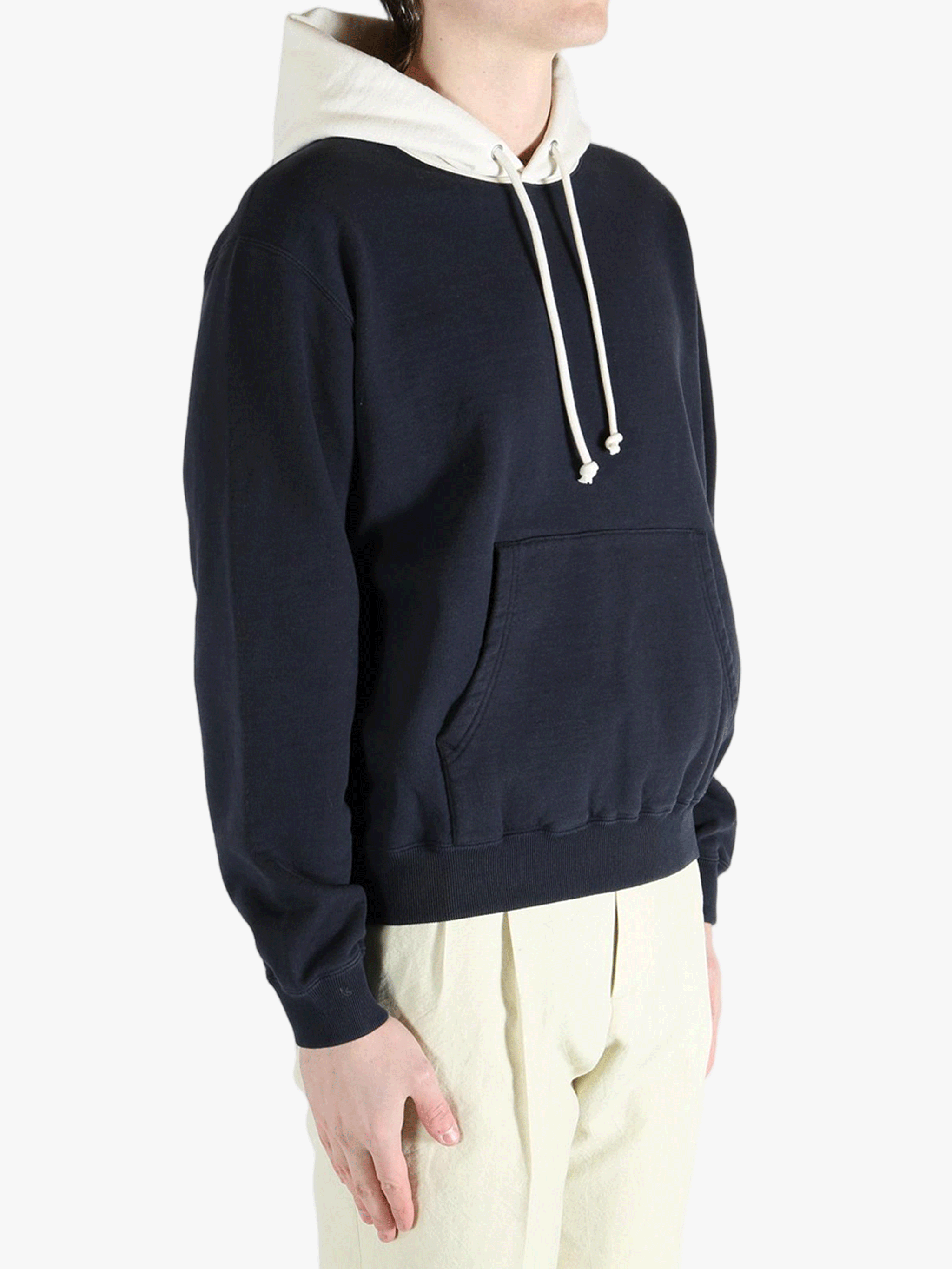 Navy hoodies worn by a person, showing teh hoodies' fit
