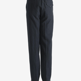 Black pants worn by a person, showing the pants fit