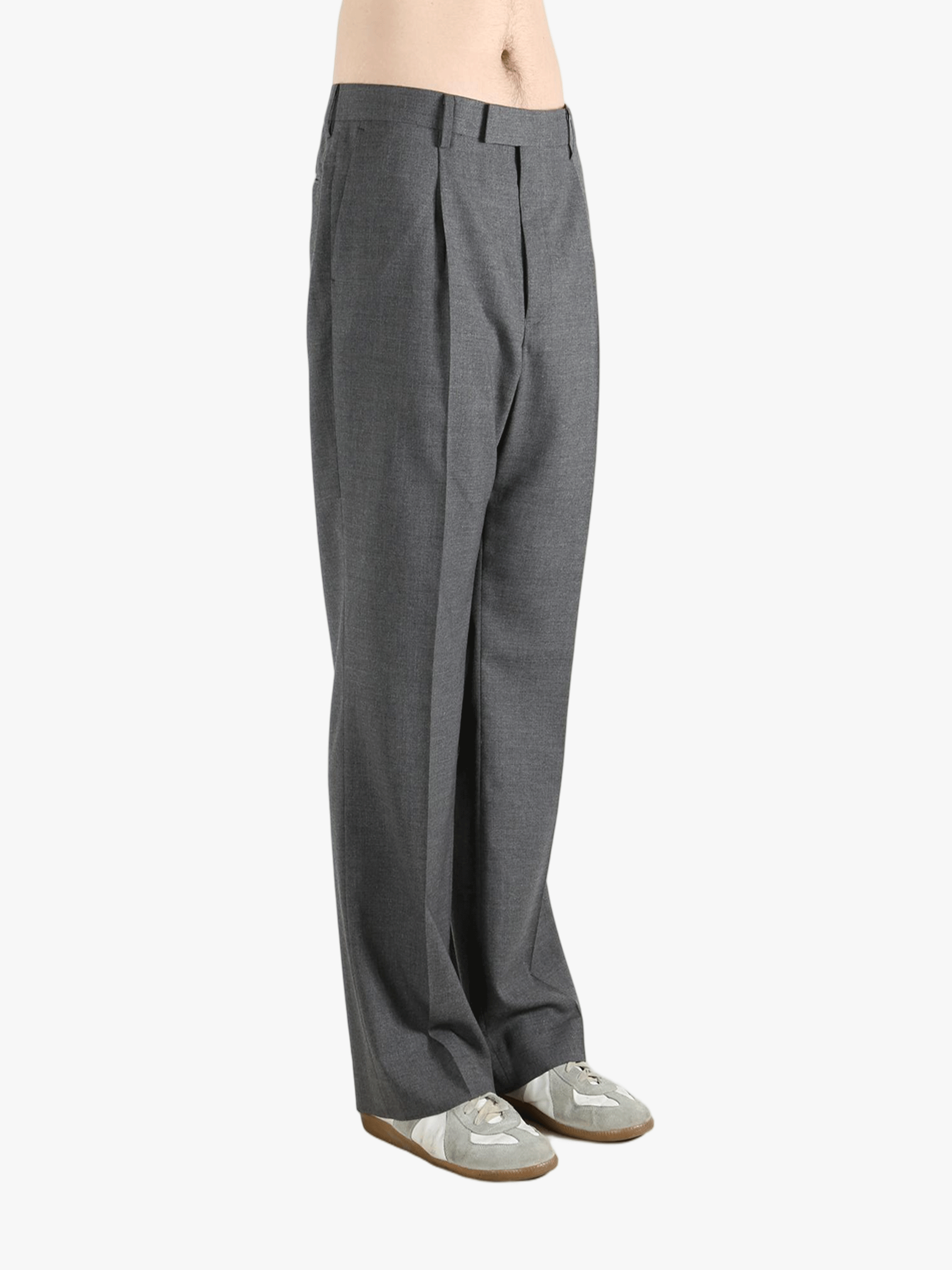 Grey pants worn by a person, showing the pants' fit