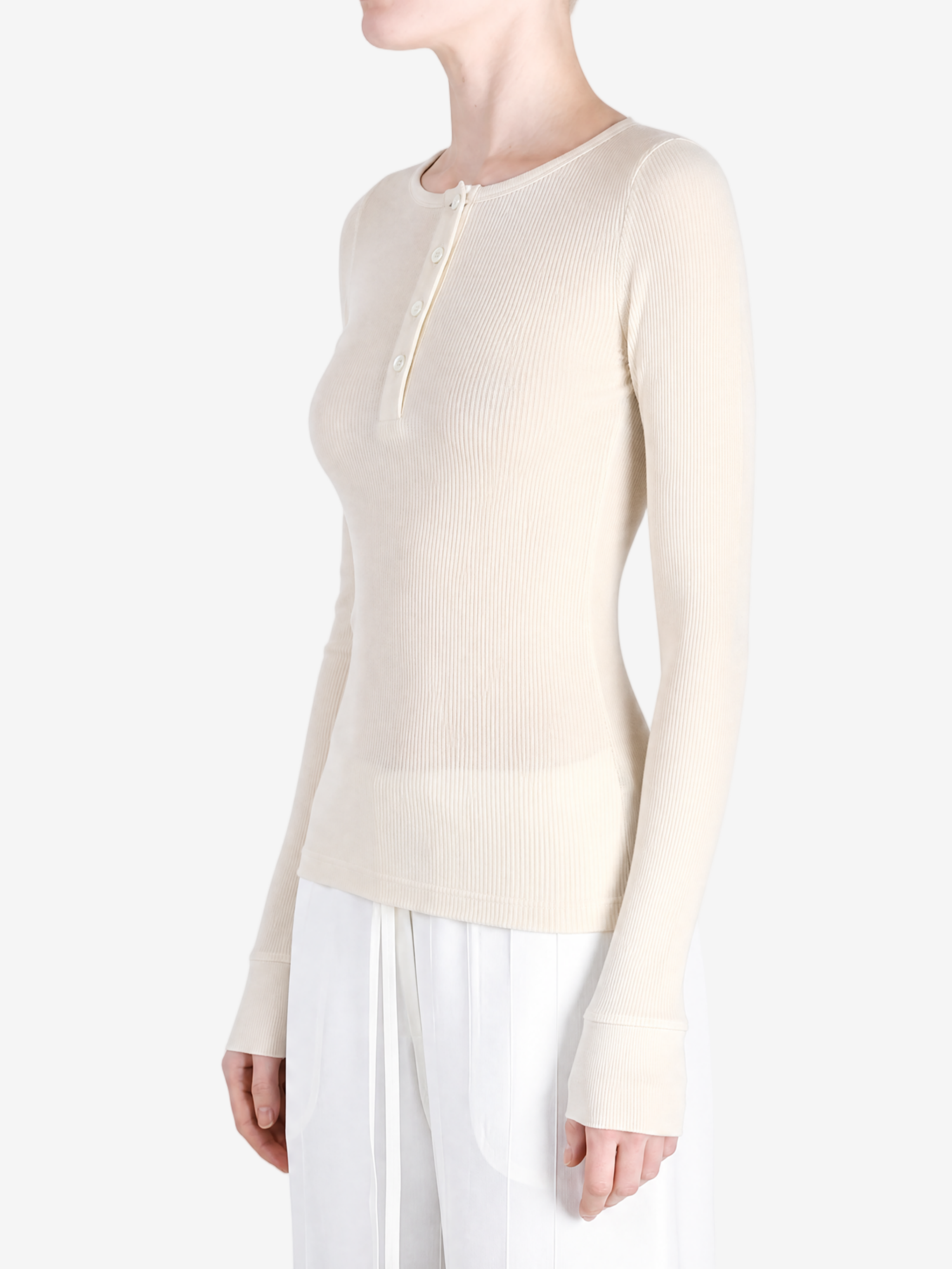Tan top worn by a person, side view
