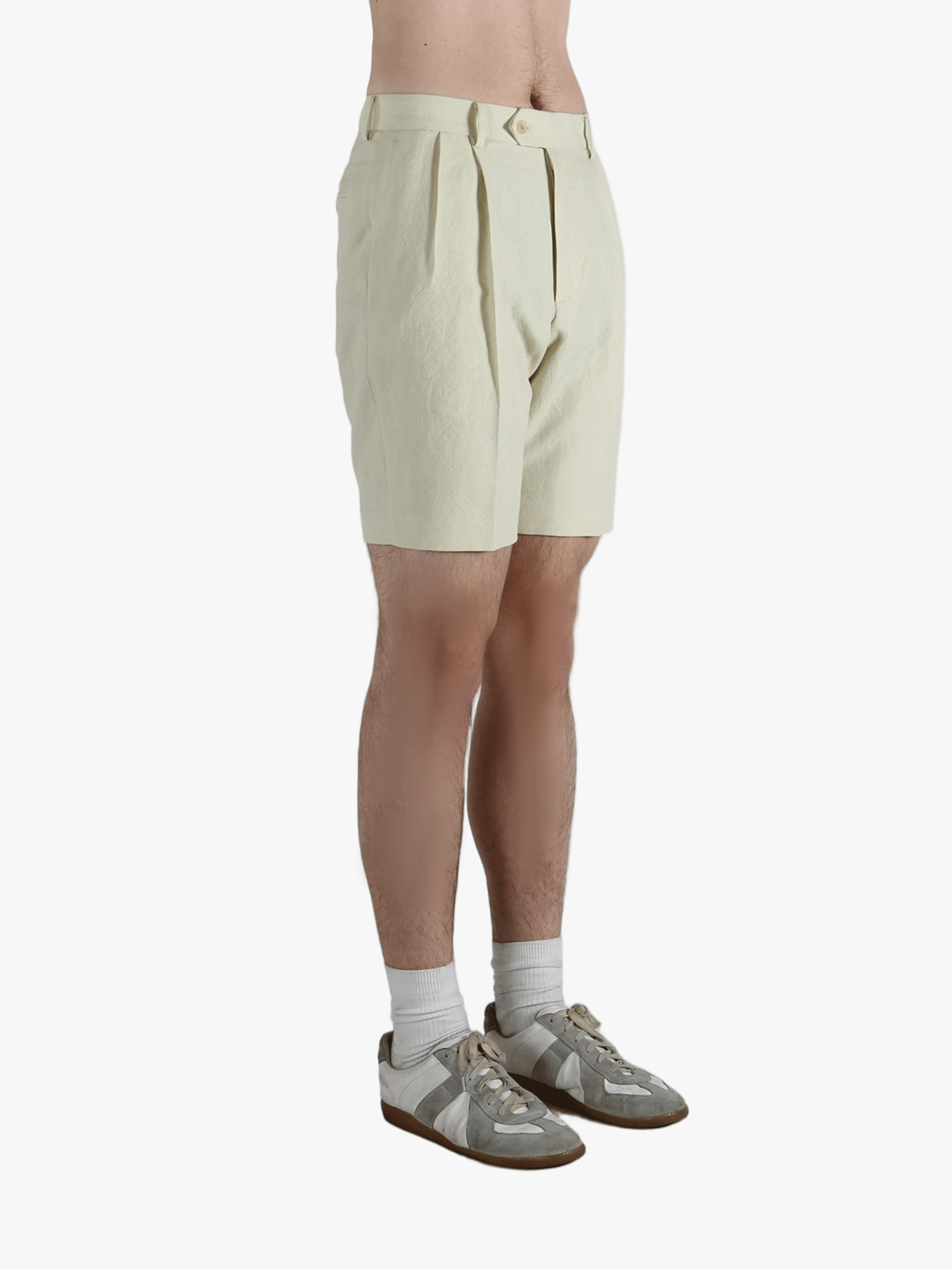 Tan shorts worn by a person, showing the shorts' fit