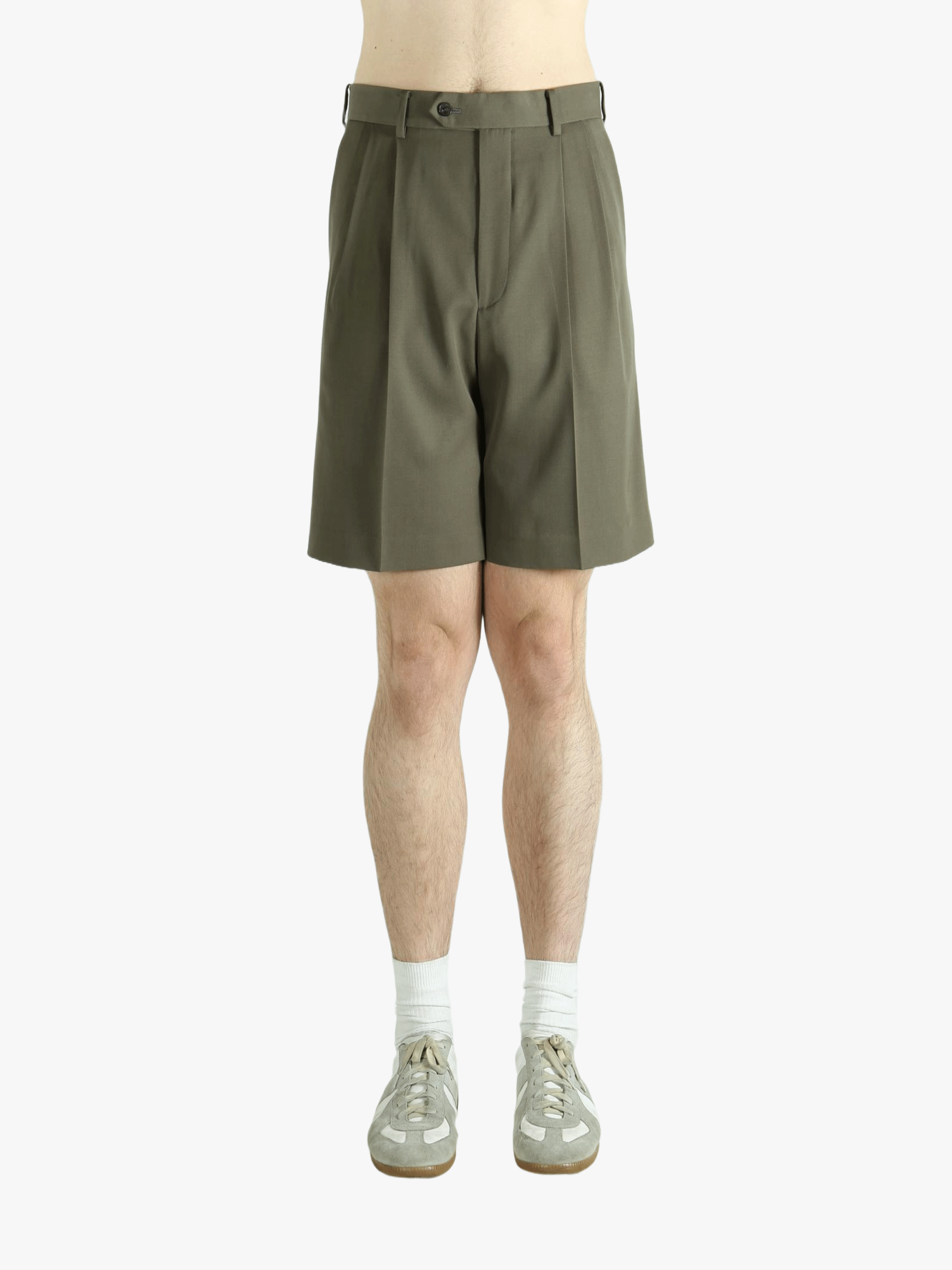 Brown shorts worn by a person, showing the shorts' fit