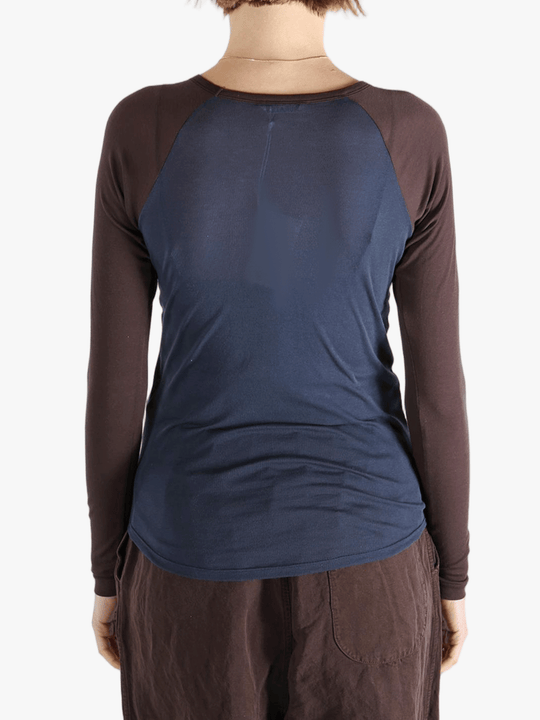 Navy top worn by a person, showing the top's fit