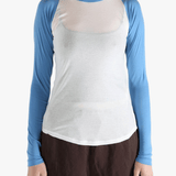 White top worn by a person, showing the top's fit