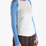 White top worn by a person, showing the top's fit