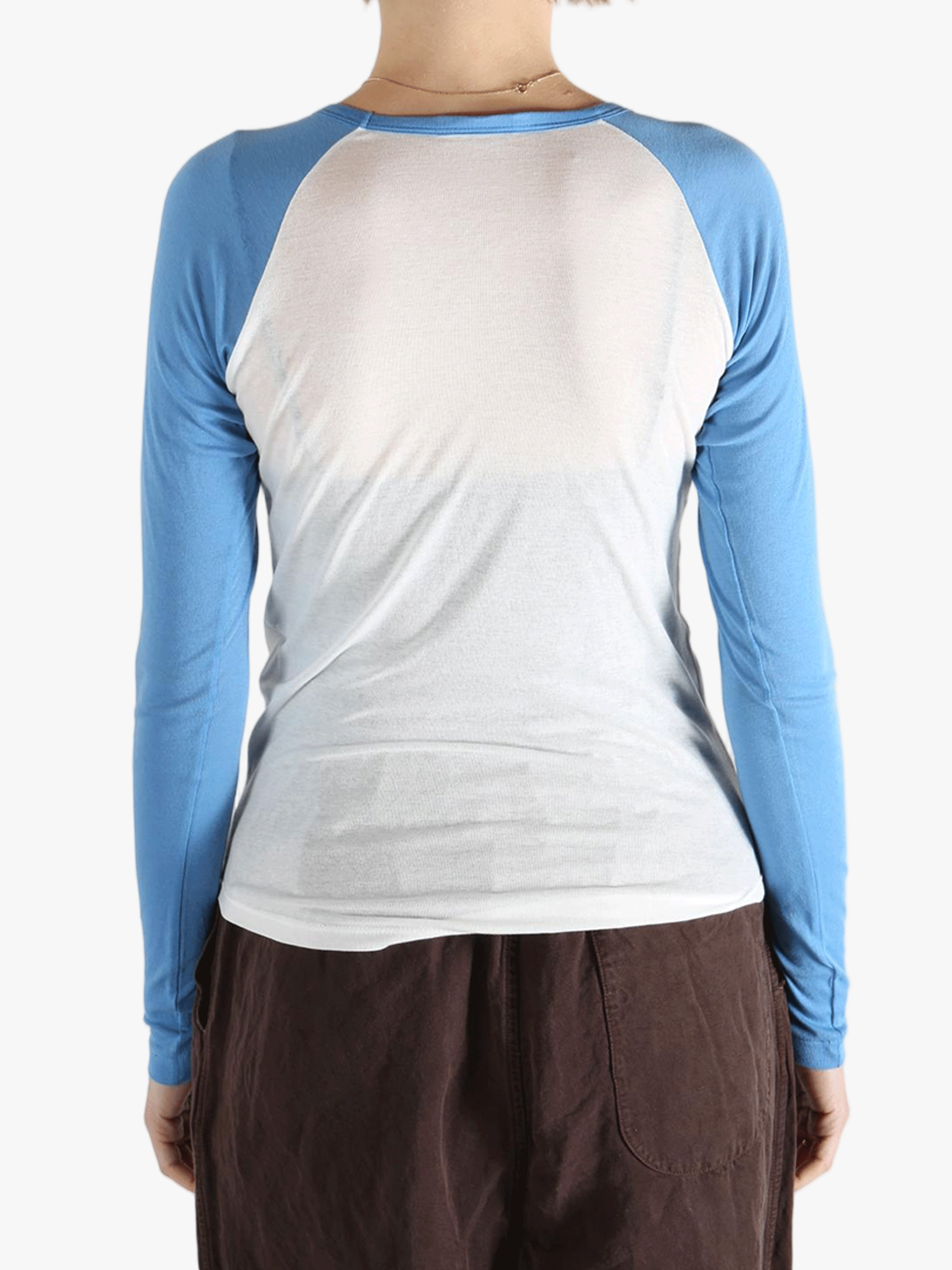 White top worn by a person, showing the top's fit