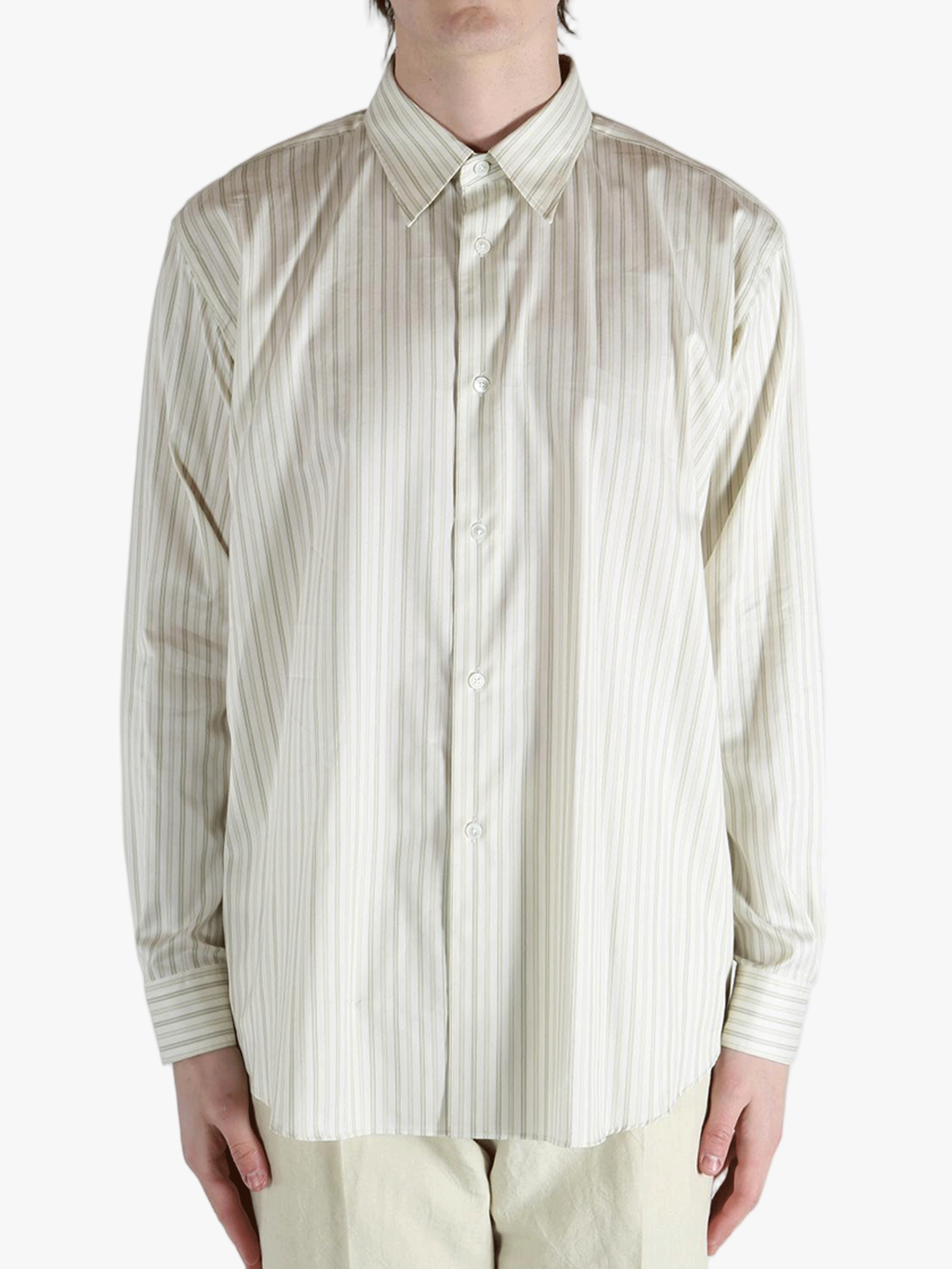 White shirt worn by a person, showing the shirt's fit