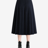 Navy skirts worn a person,showing the skirts fit