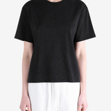 Black t-shirt worn by a person, showing the t-shirt's fit