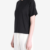 Black t-shirt worn by a person, showing the t-shirt's fit