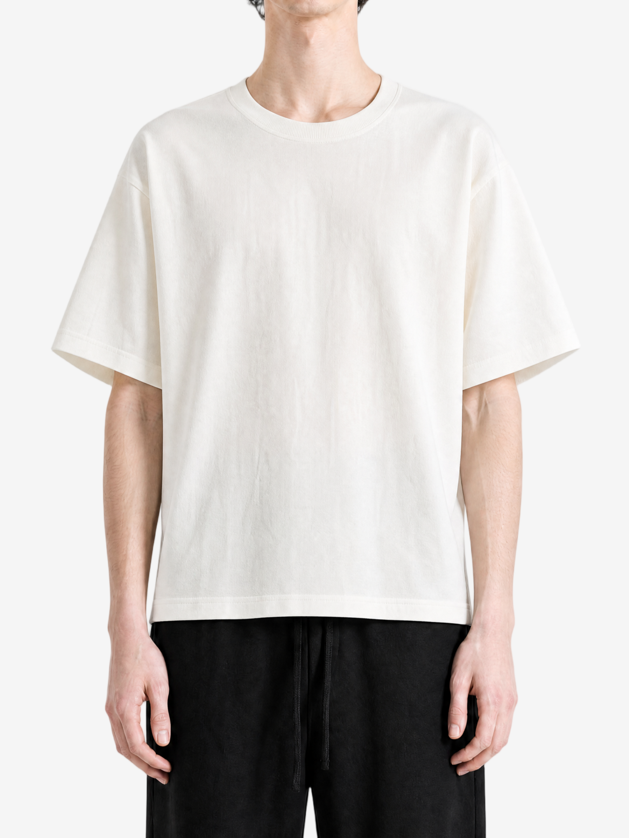 White t-shirt worn by a person, showing the t-shirt fit