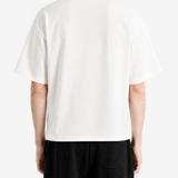 White t-shirt worn by a person, back view