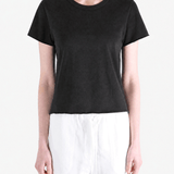 Black tee worn by a person, showing the tee fit