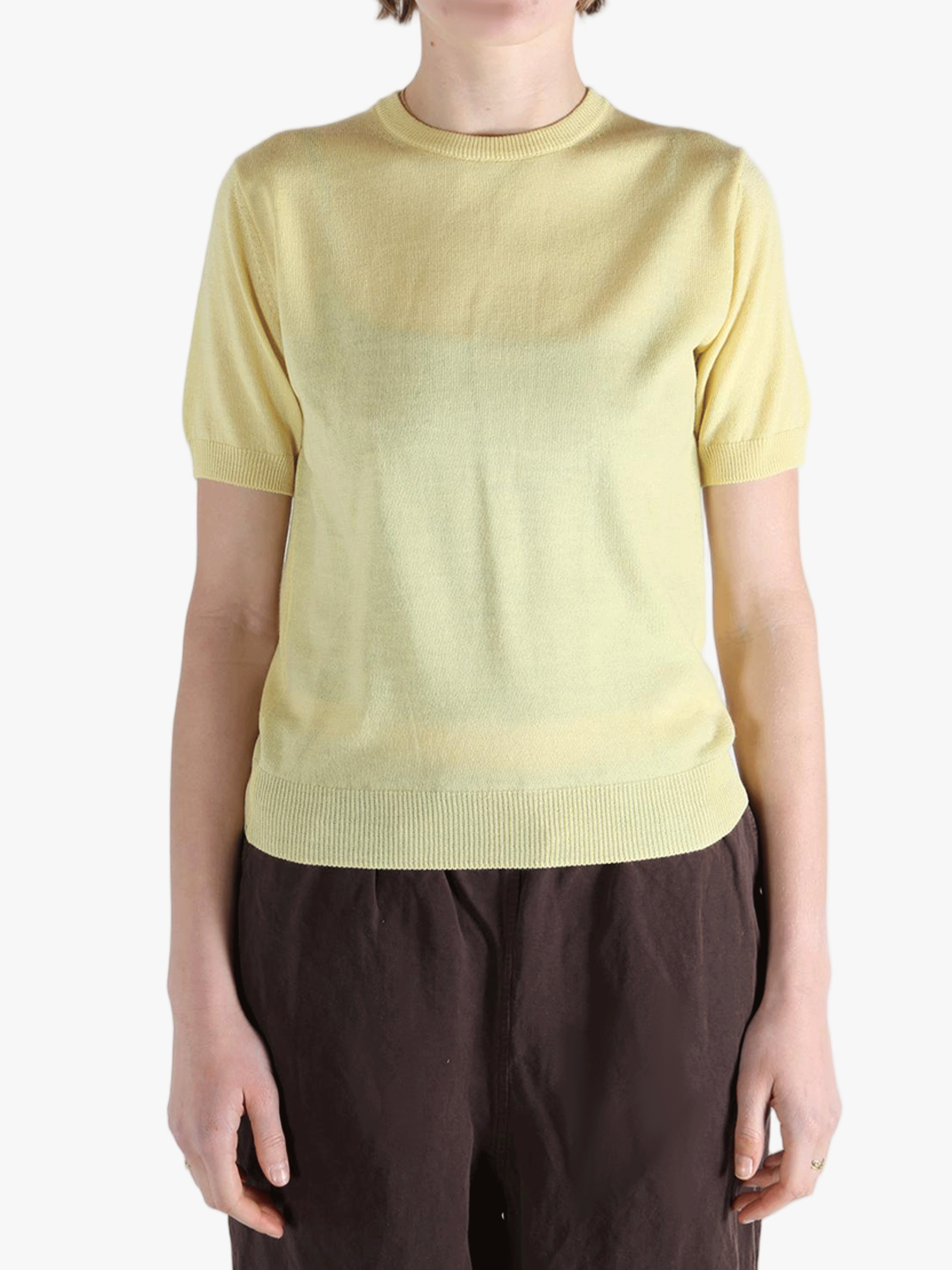 Yellow t-shirt worn by a person, showing the t-shirt's fit