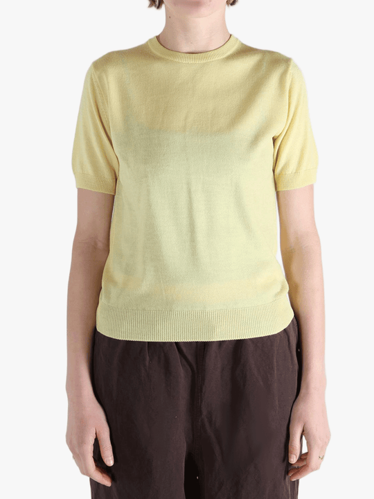 Yellow t-shirt worn by a person, showing the t-shirt's fit