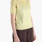 Yellow t-shirt worn by a person, showing the t-shirt's fit