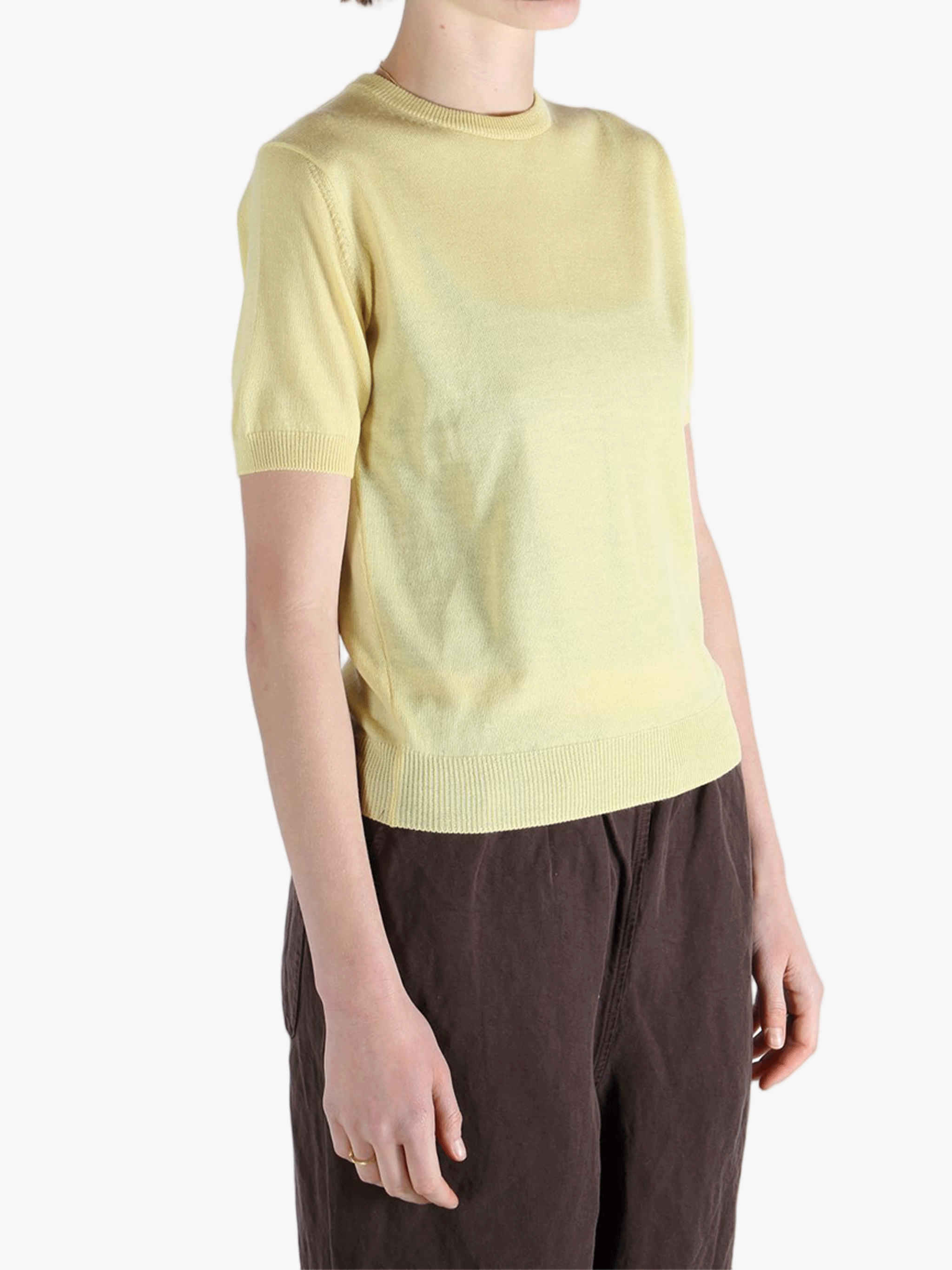 Yellow t-shirt worn by a person, showing the t-shirt's fit