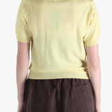 Yellow t-shirt worn by a person, showing the t-shirt's fit