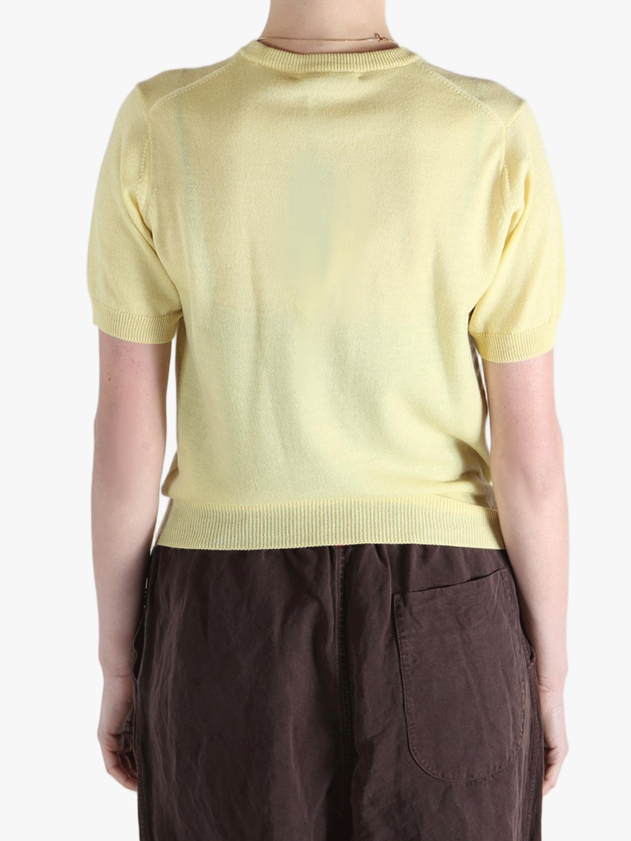 Yellow t-shirt worn by a person, showing the t-shirt's fit