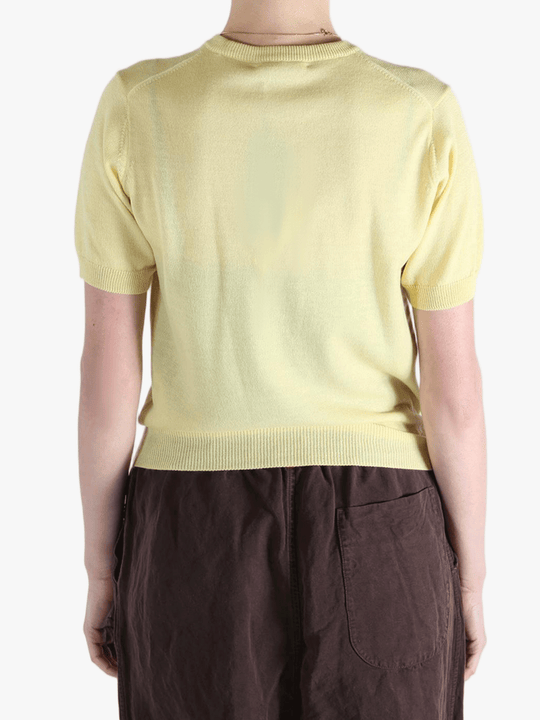 Yellow t-shirt worn by a person, showing the t-shirt's fit
