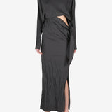 Black dress worn by a person, showing the dress's fit