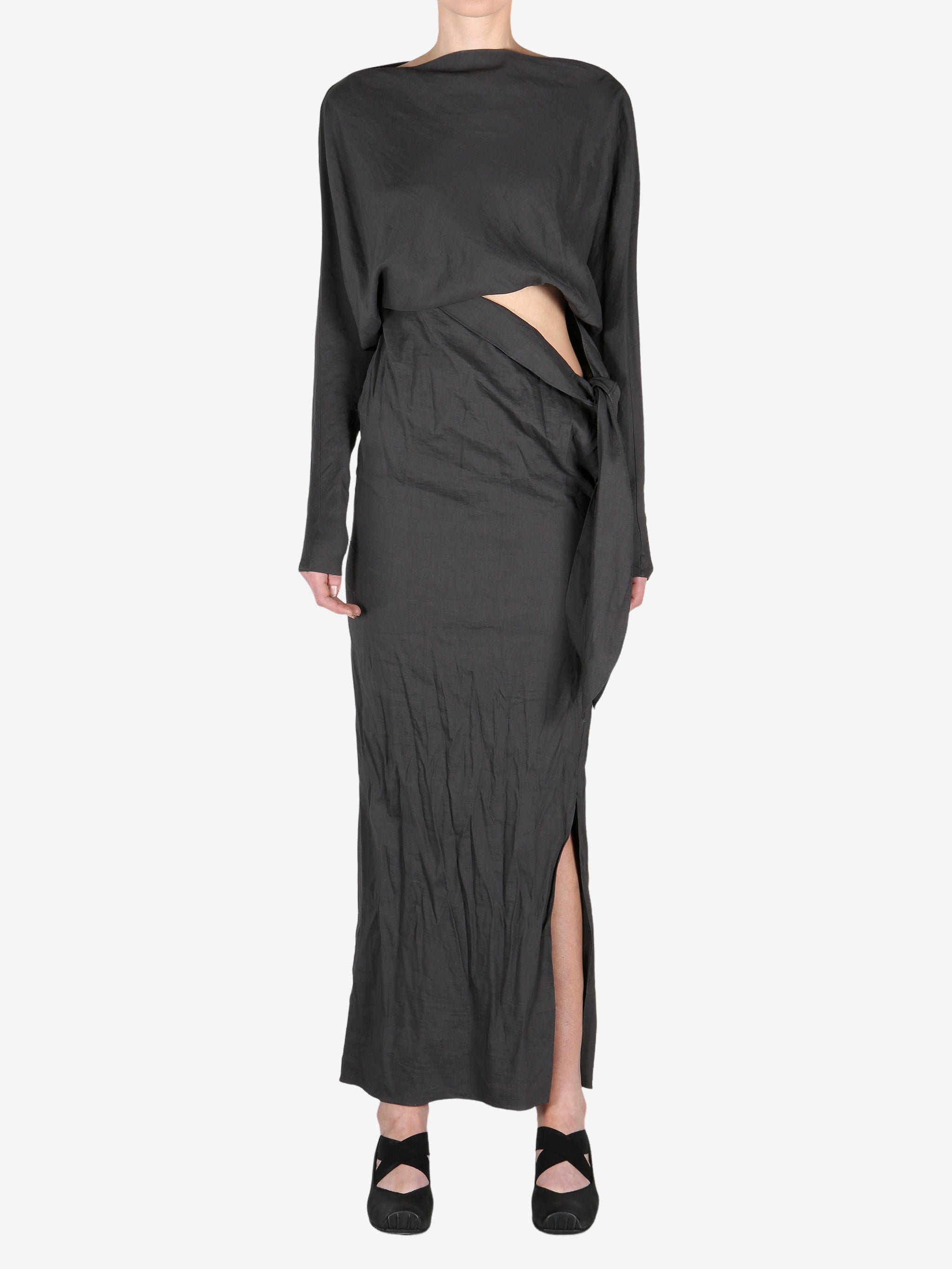 Black dress worn by a person, showing the dress's fit