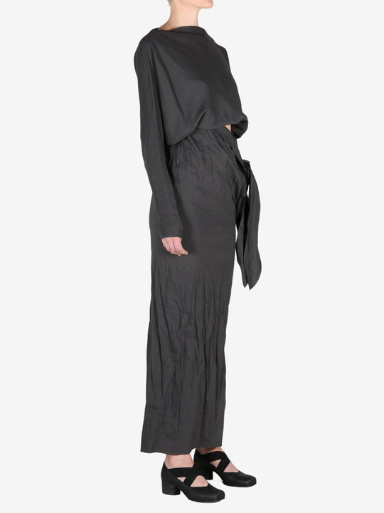 Black dress worn by a person, showing the dress's fit