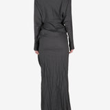 Black dress worn by a person, showing the dress's fit