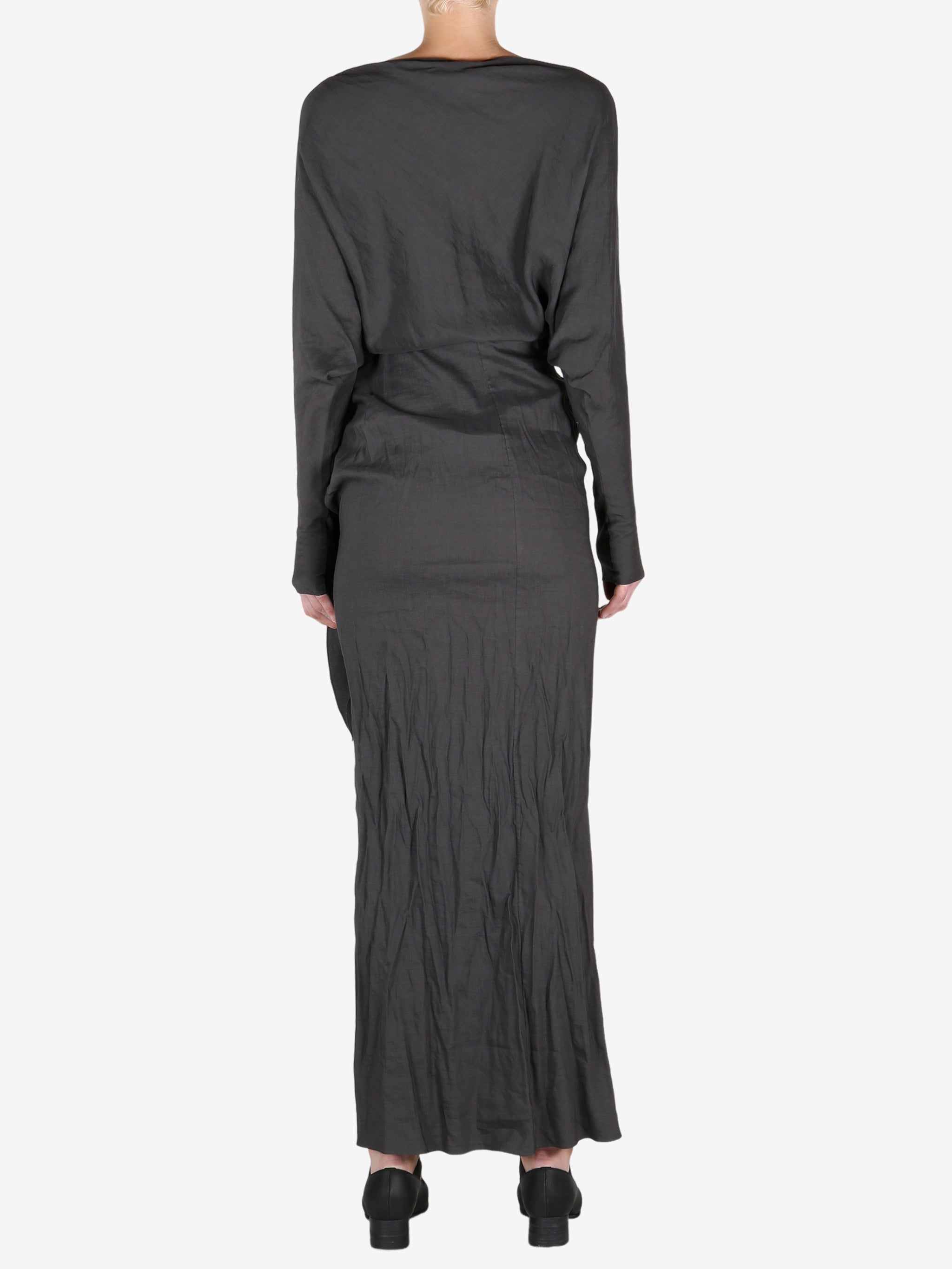 Black dress worn by a person, showing the dress's fit