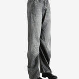 Gray pants worn by a person, showing the pants' fit