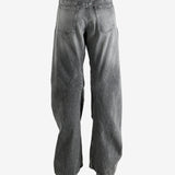 Gray pants worn by a person, showing the pants' fit