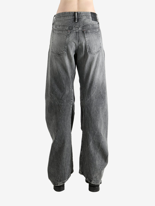 Gray pants worn by a person, showing the pants' fit