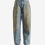 Blue pants worn by a person, showing the pants' fit