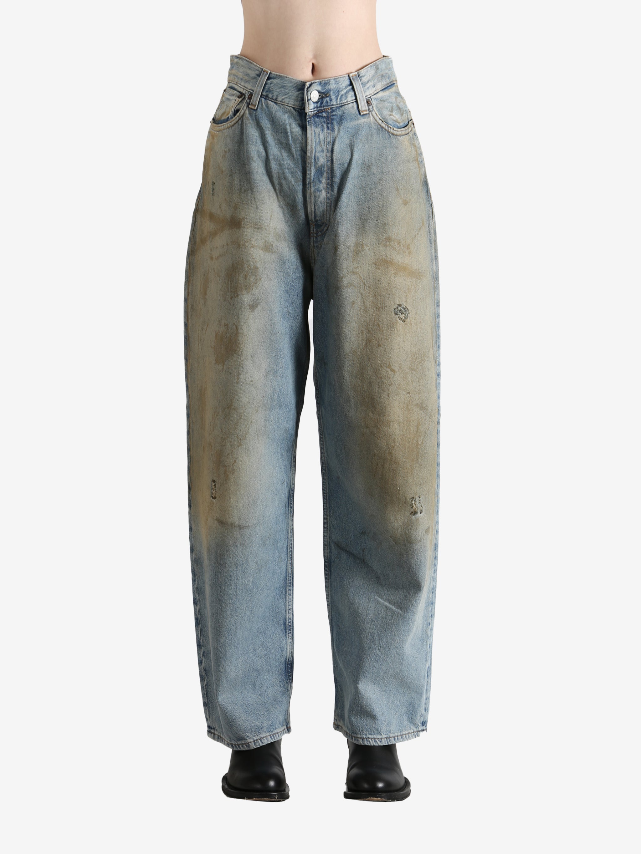 Blue pants worn by a person, showing the pants' fit