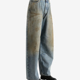 Blue pants worn by a person, showing the pants' fit