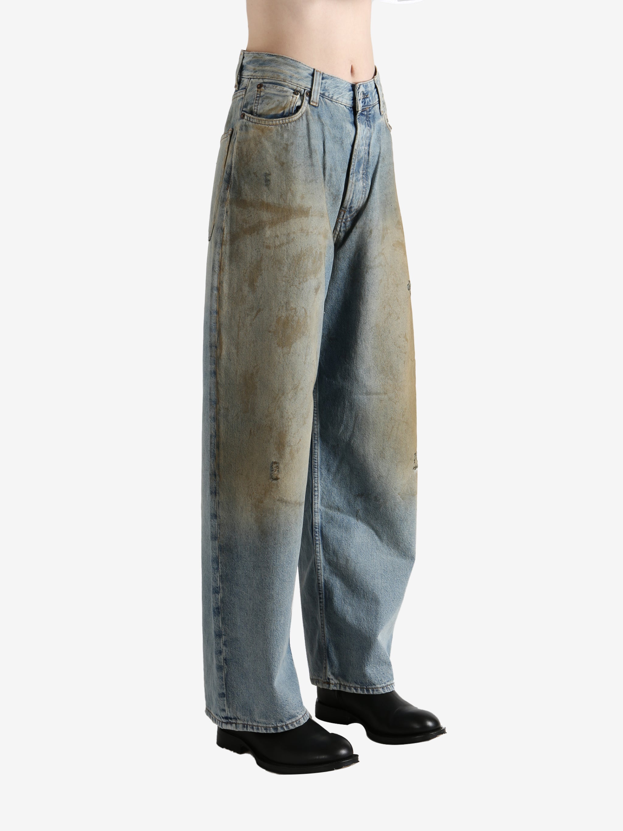 Blue pants worn by a person, showing the pants' fit