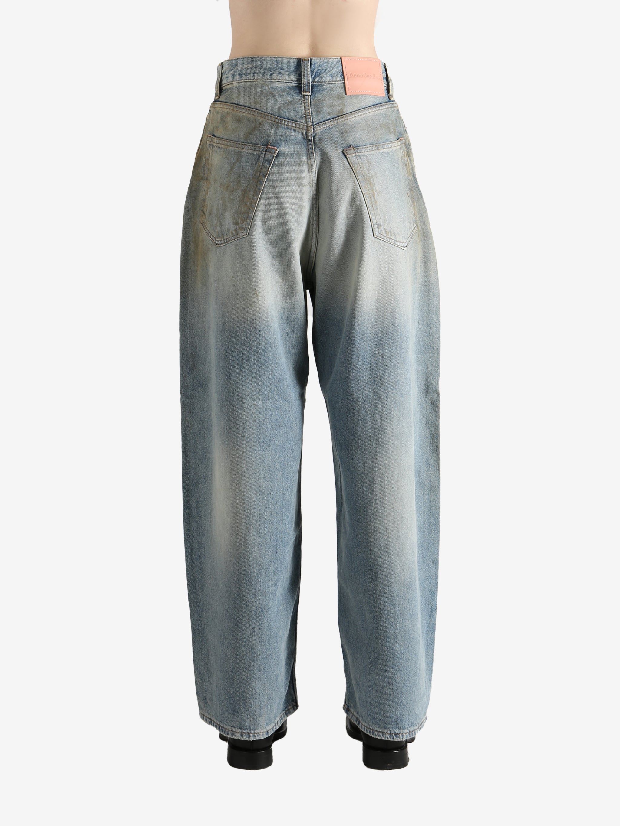 Blue pants worn by a person, showing the pants' fit