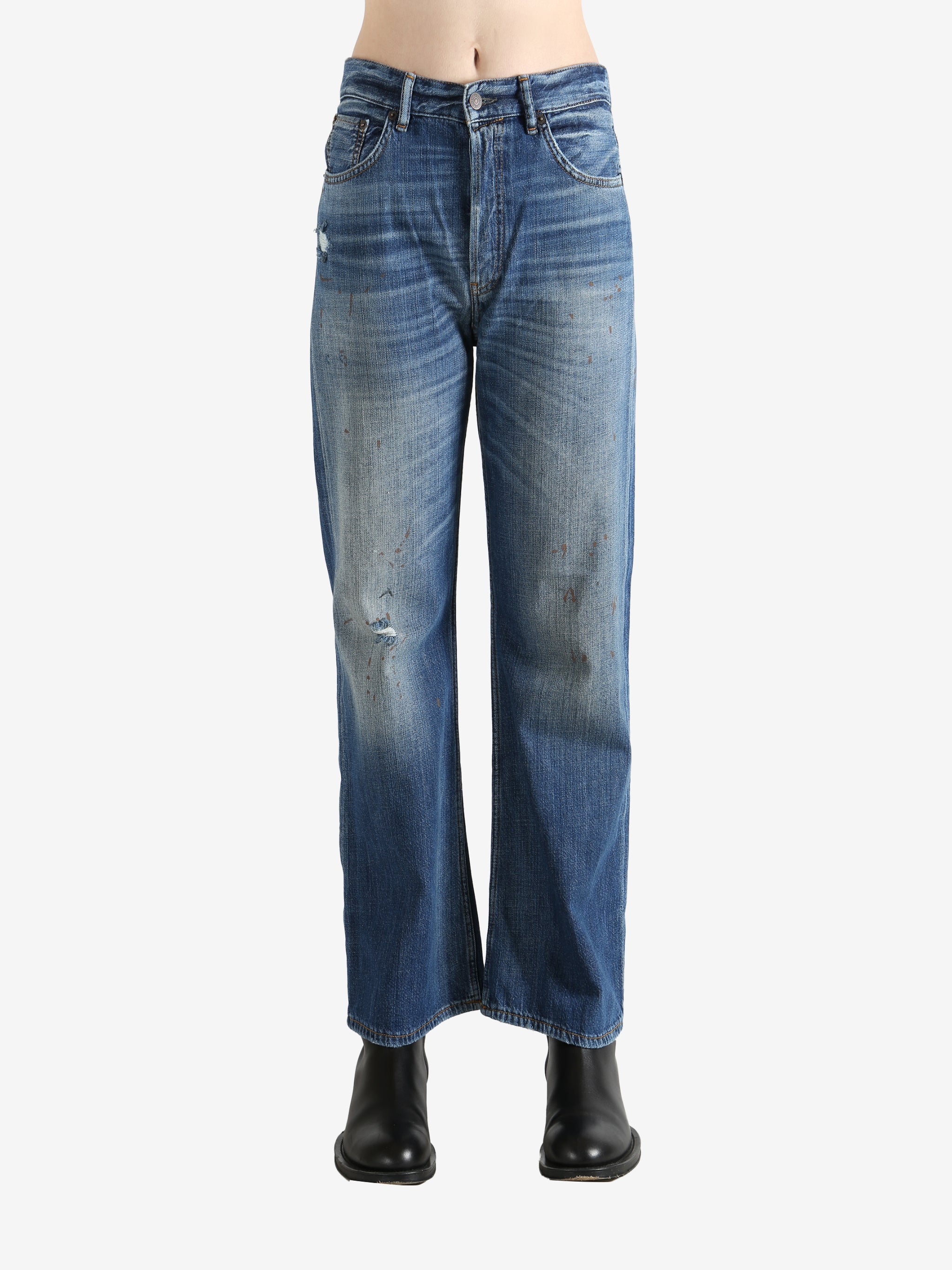 Blue pants worn by a person, showing the pants' fit