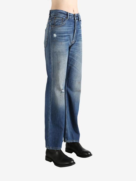 Blue pants worn by a person, showing the pants' fit