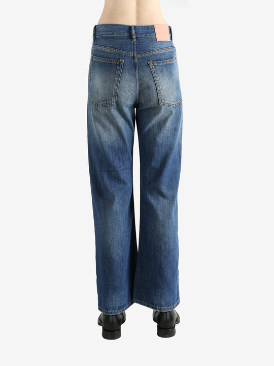 Blue pants worn by a person, showing the pants' fit