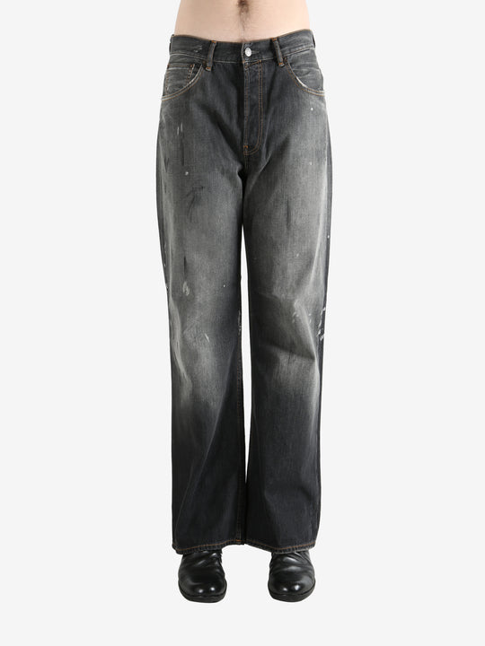 Black pant worn by a person, showing the pant's fit